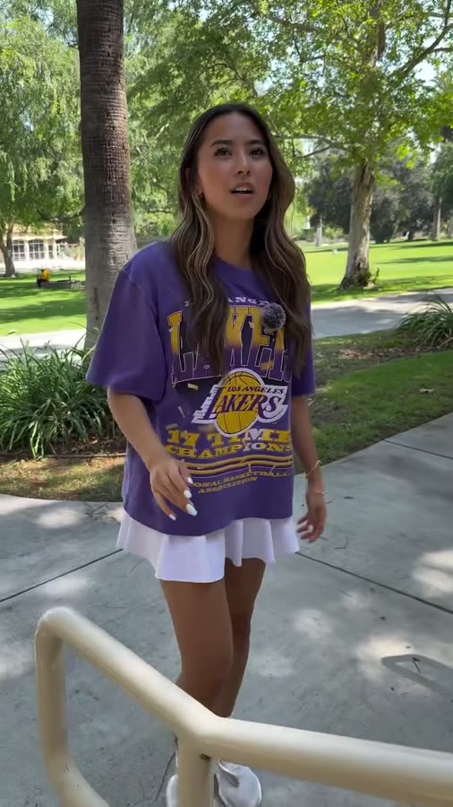 A student answering questions while walking through campus.